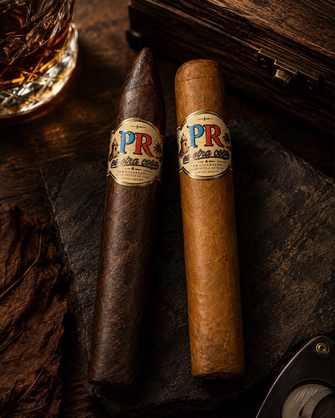 El Cigarreño Torpedo Maduro next to a Connecticut on slate